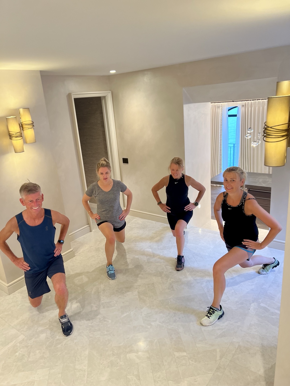 Cathy training with a small group, all lunging in unison