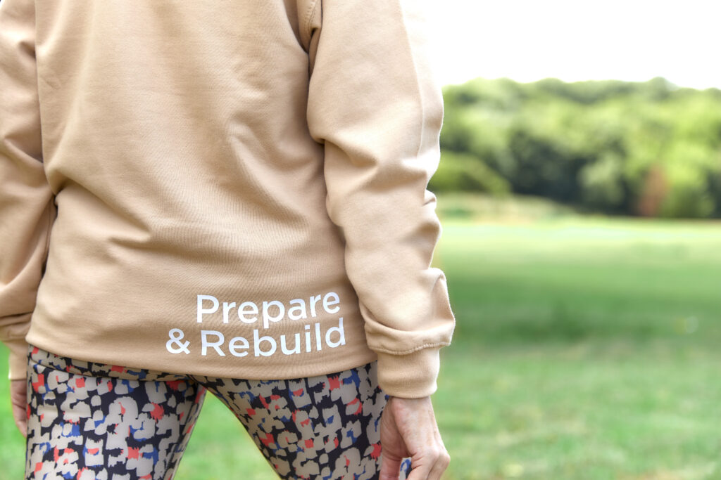 Person standing outdoors ready for a personal training session.
