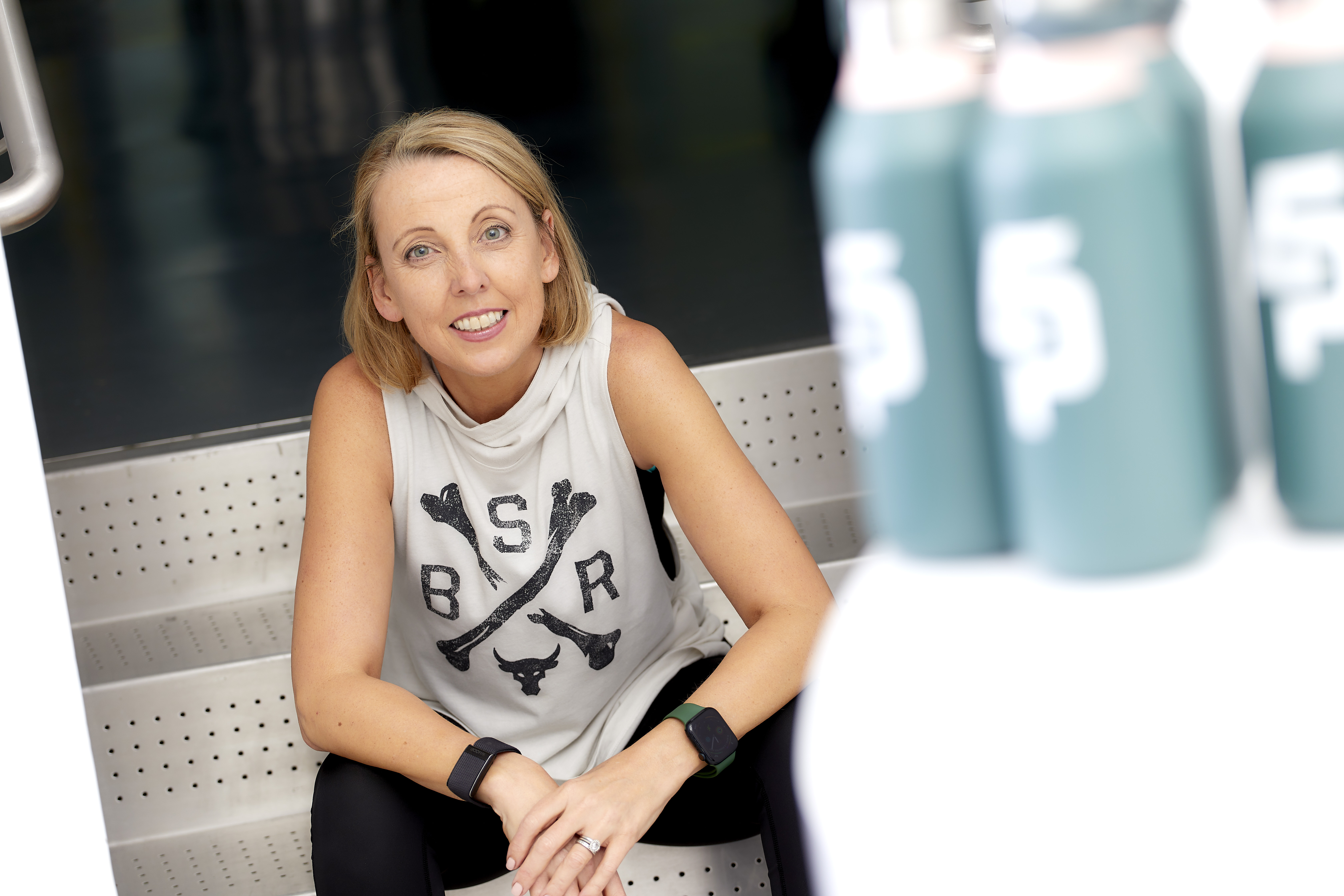 Tracey Pinfold, personal trainer and founder of Exercise Prescription, sitting in a gym.