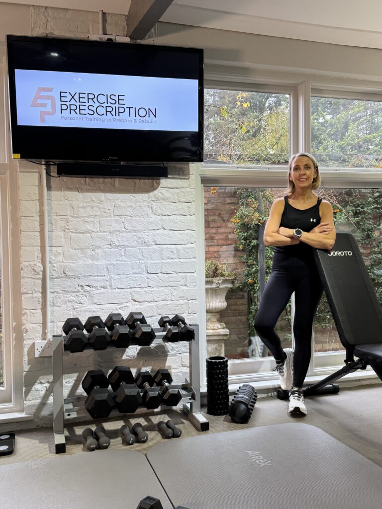 Tracey Pinfold, founder of Exercise Prescription, standing in the training studio.
