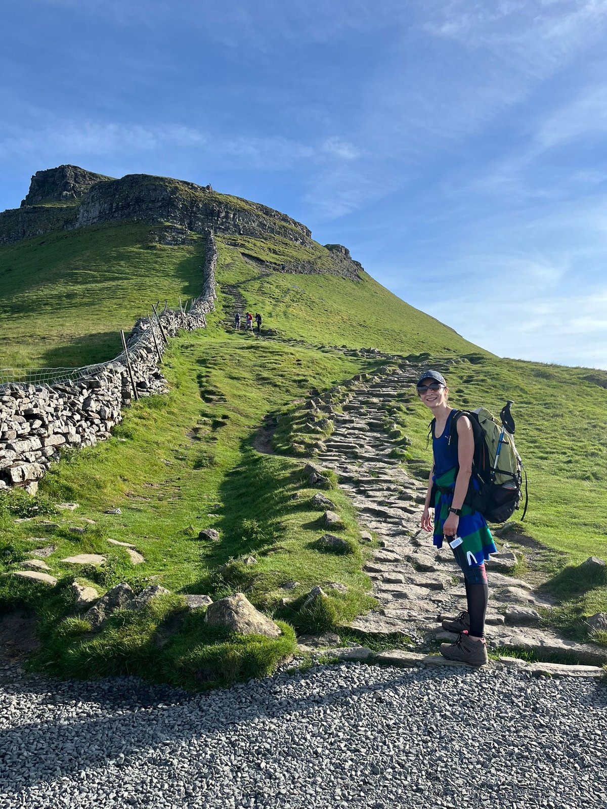 Karima Ngaage climbing the stepped path towards the summit of Pen-y-ghent
